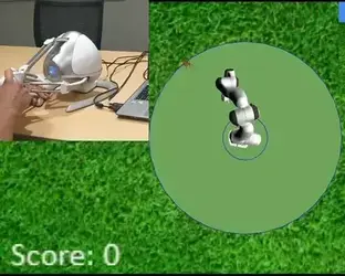 A 3 degree of freedom Novint Falcon device is used to move a mouse away from the simulated robot arm trying to catch it.